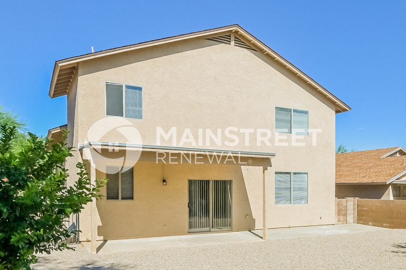 a house with a gated entrance and a garage