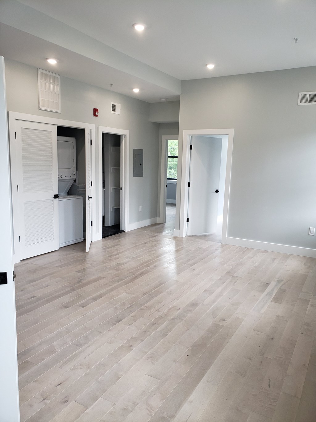 the living room is open to the dining room and kitchen