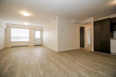 A room with wooden floors and white walls.