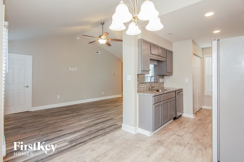the kitchen is open to the living room and dining room