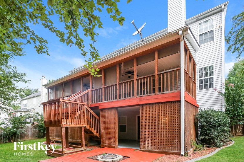 a house with a wooden deck and a porch