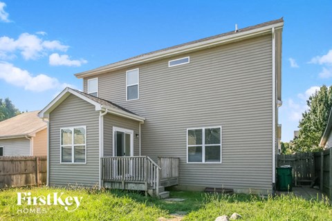 the exterior of a house with a porch and a deck