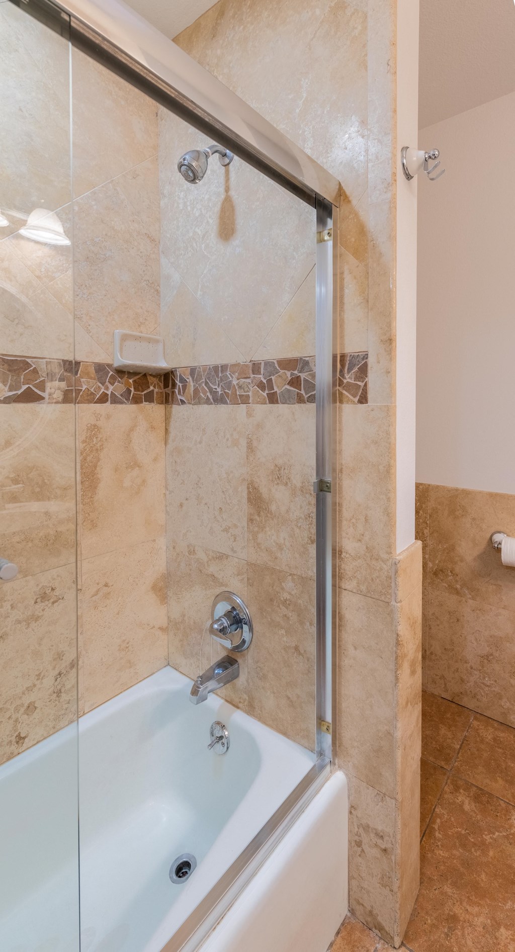 a shower and a bath tub in a bathroom