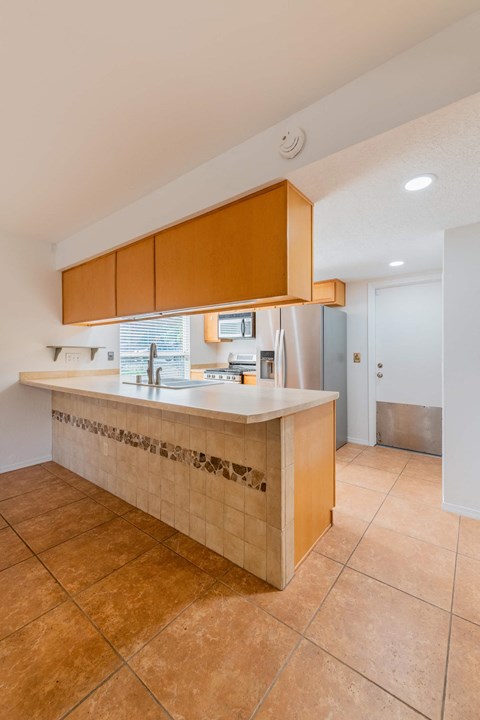 a kitchen with a counter top and a sink