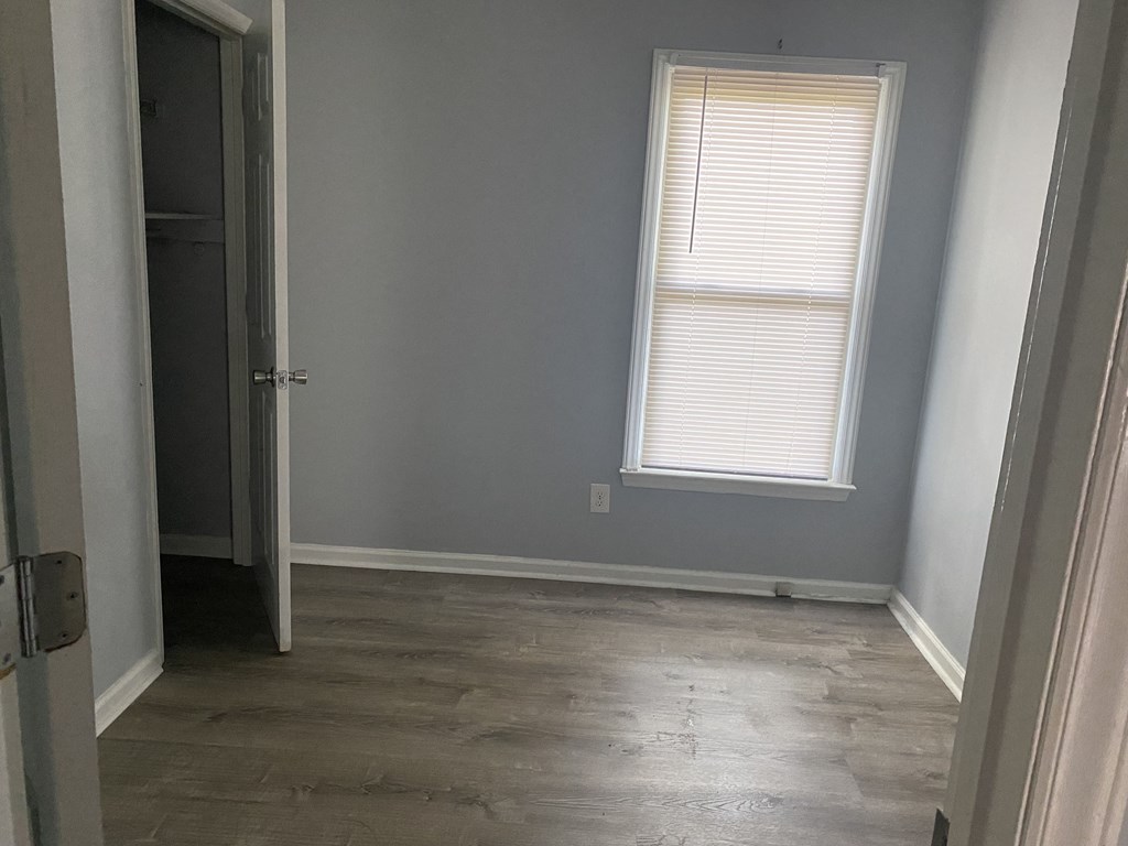 A room with a door and a window.