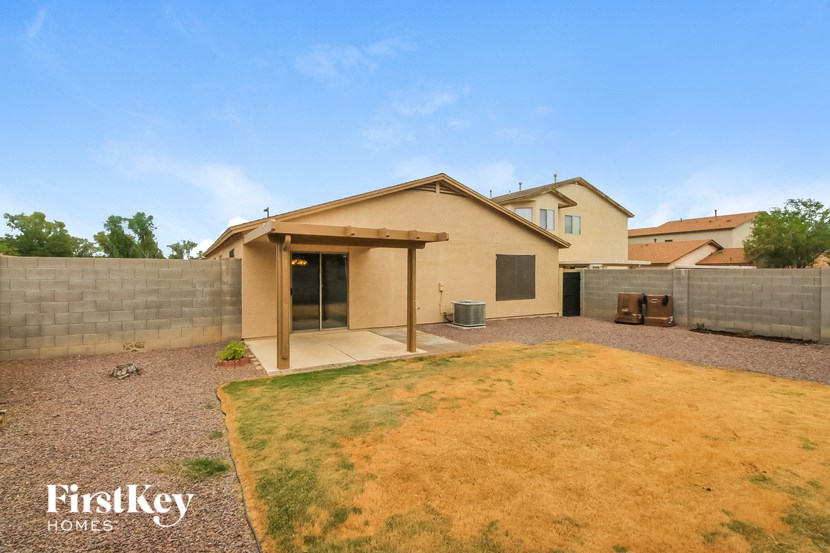 a backyard with a yard and a house