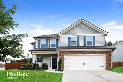 a suburban house with a white garage door