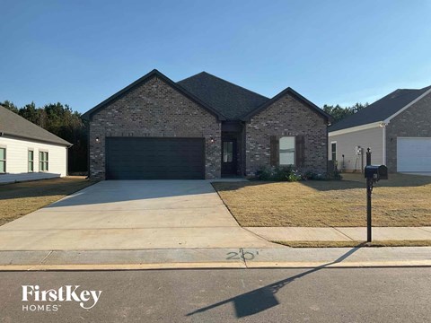 a house with a driveway and a garage door