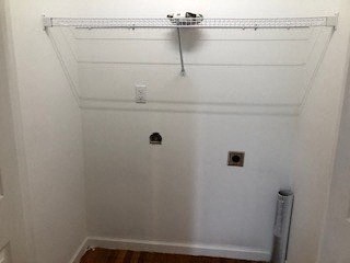 a white room with a white wall and a shelf