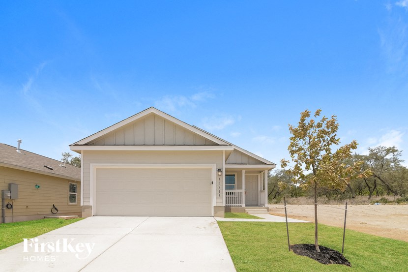 a home with a driveway and a garage door