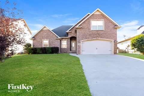 A house with a driveway in front of it.