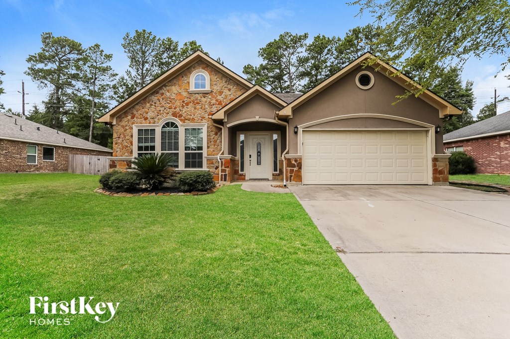 a home with a lawn and a driveway