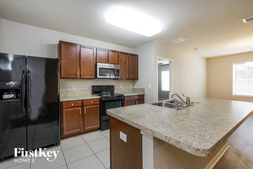 a kitchen with a counter top and a sink