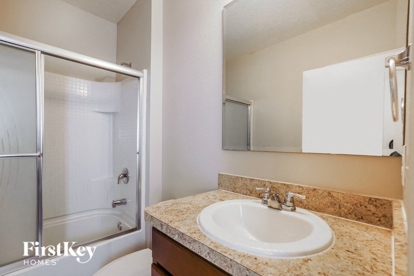 a bathroom with a sink and a shower