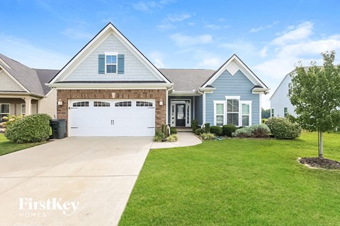 a blue house with a white garage door