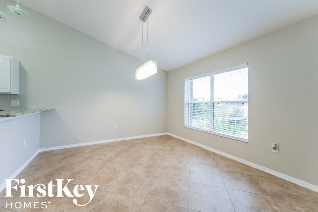 A room with a FirstKey Homes logo on the floor.