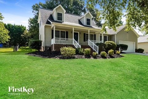 a house with a lawn and a front yard