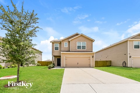 A house with a tree in front of it and the words "firstkey homes" on the tree.