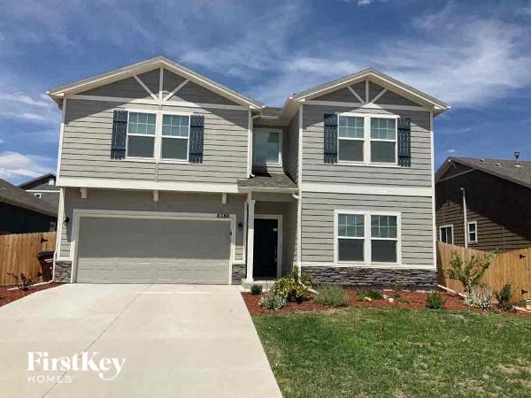 a house with a driveway and a garage door