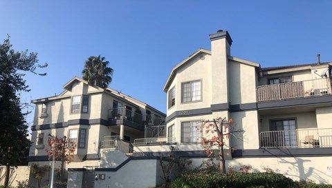 A two-story building with a balcony on the second floor.