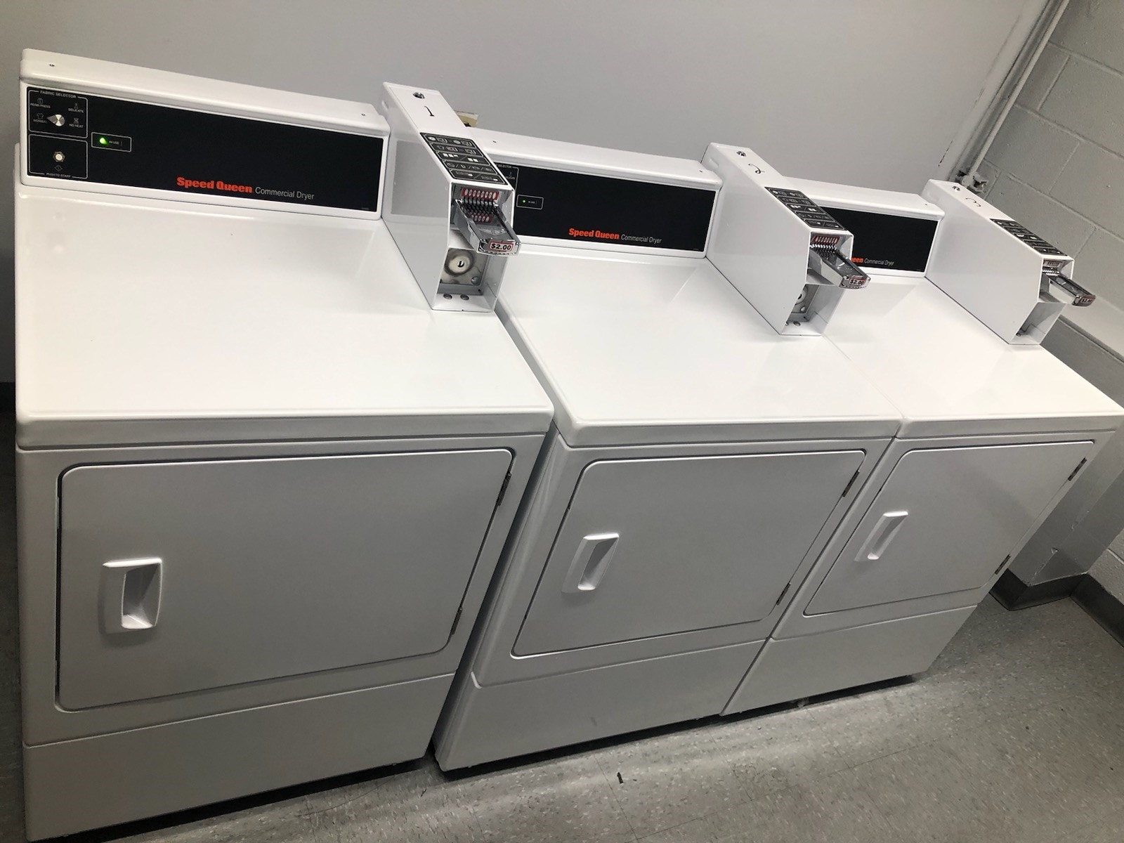 Two large white boxes with a digital display on top.
