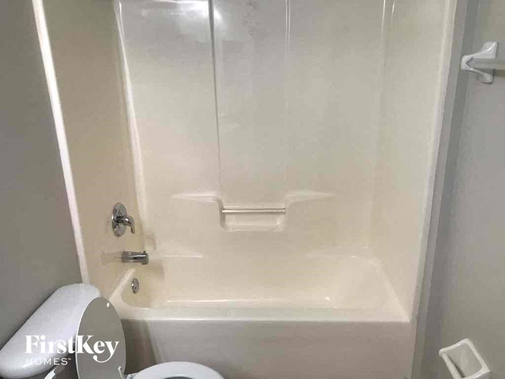 a small bathroom with a shower and a toilet