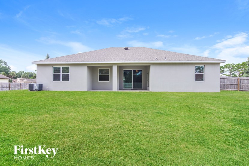 A house with a lawn in front of it.