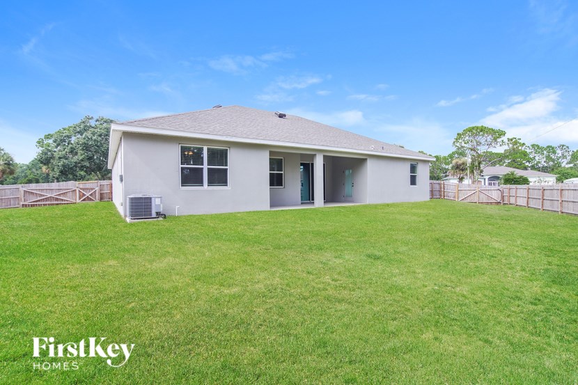 A house with a lawn in front of it.