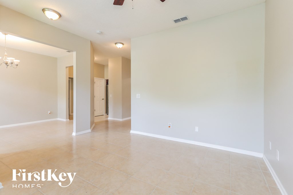 the living room and dining room are spacious and empty