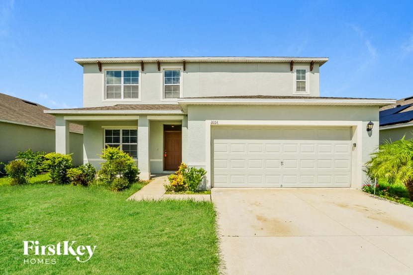 A two-story house with a garage is for sale by FirstKey Homes.