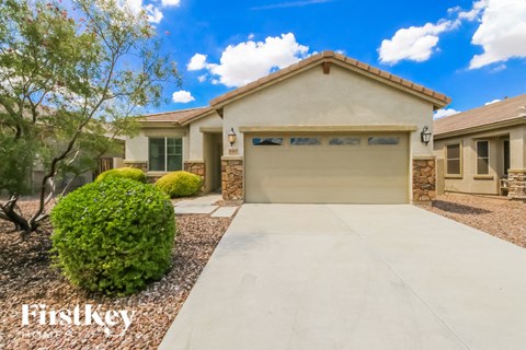a home with a driveway and a garage door