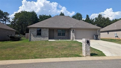 a brick house on the side of a street