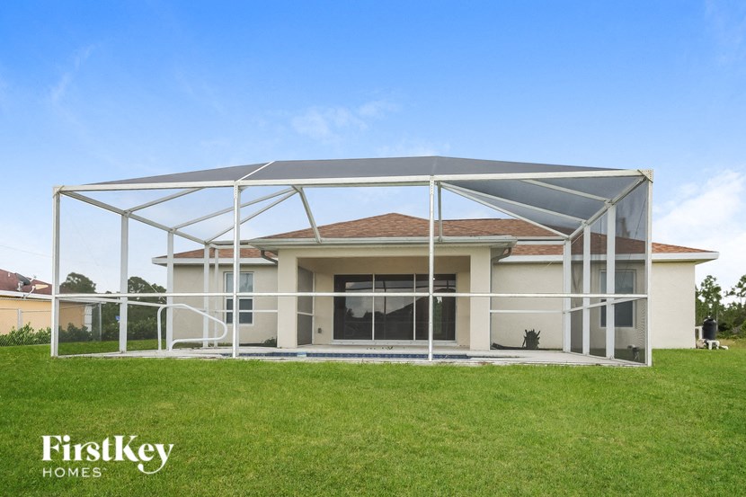 a house with a patio and a white canopy