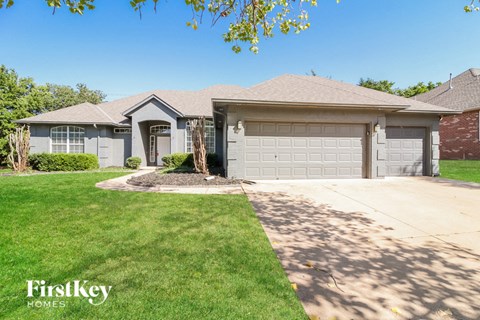 a house with a driveway and a garage door