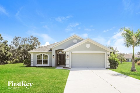 a home with a lawn and a driveway