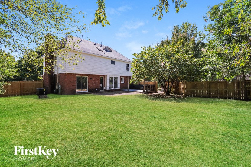 A house with a lawn in front of it.