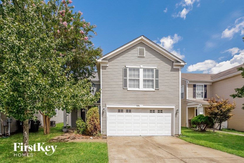 a gray house with a white garage door
