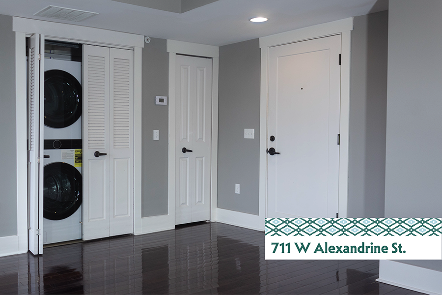 A laundry room with a washer and dryer in it.