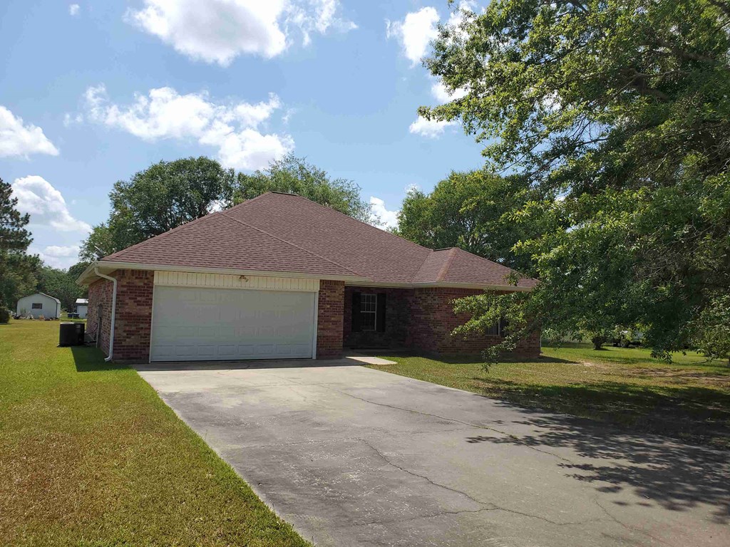 A house with a garage and a driveway.