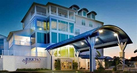 a large blue and white building with a blue roof
