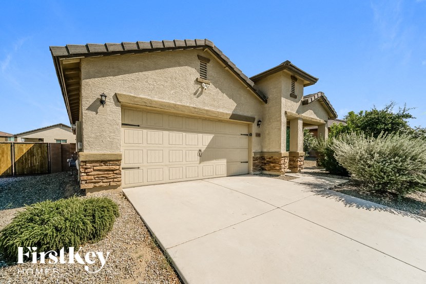 a garage door in front of a house with a driveway