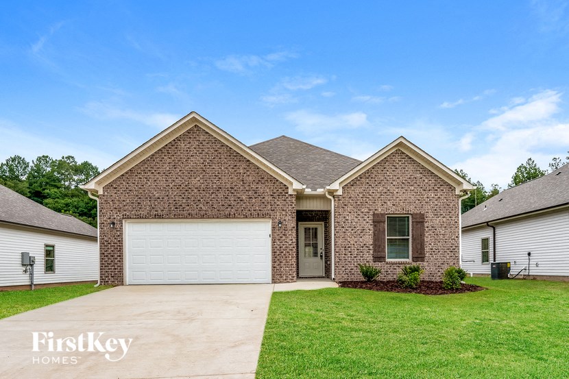 a brick house with a white garage door