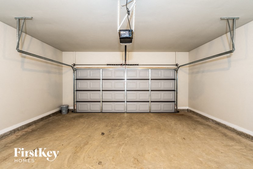 A garage with a FirstKey Homes logo.