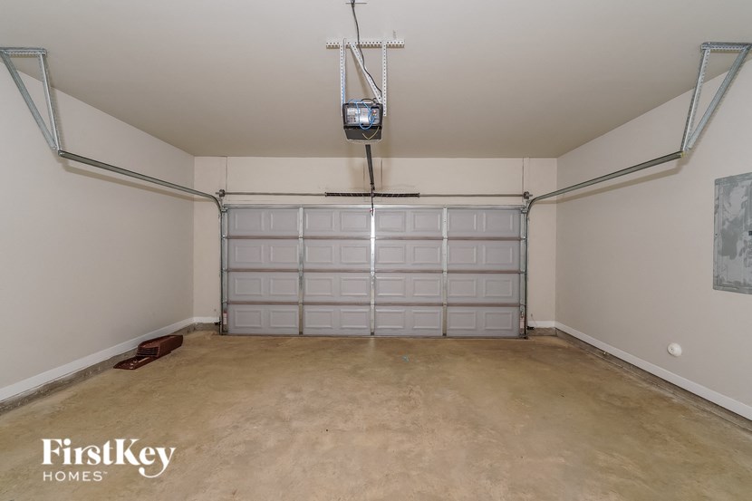 a empty garage with a wall of garage doors