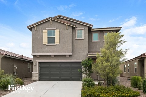 a house with a garage door in front of it