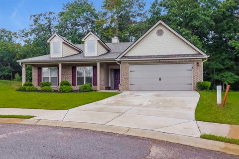a house with a driveway and a garage door