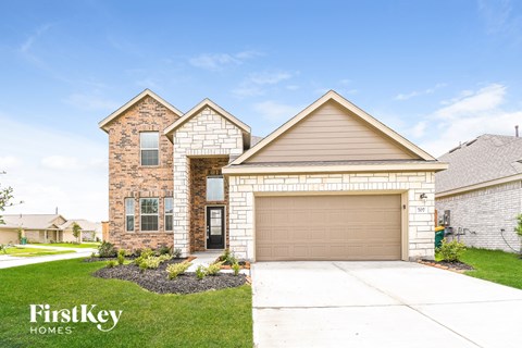 a house with a garage door in front of it