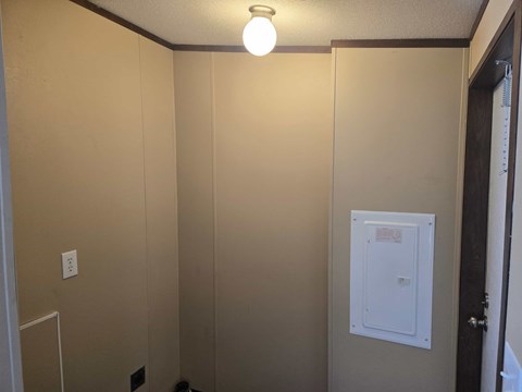 A small white box is on the wall.