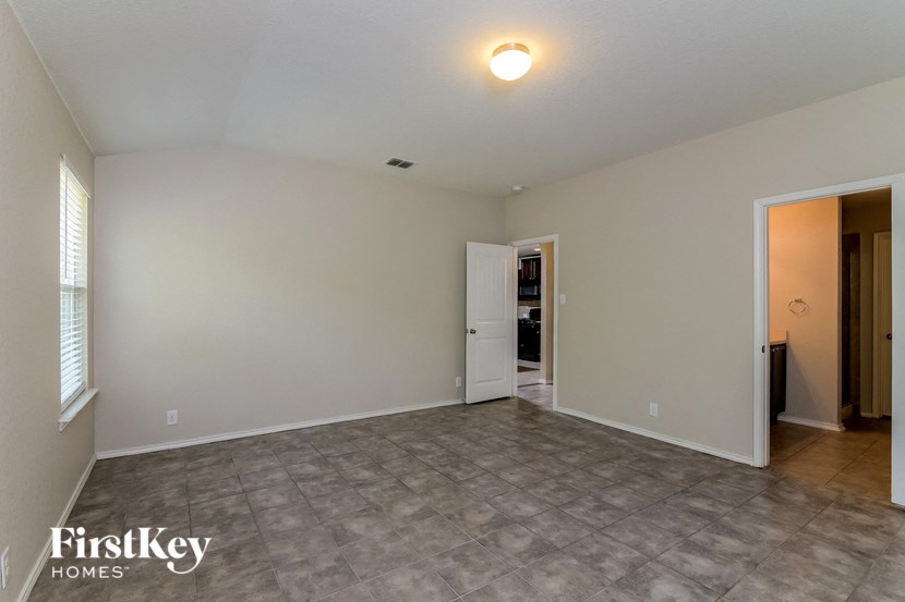 the living room is spacious and ready to be used as a family room