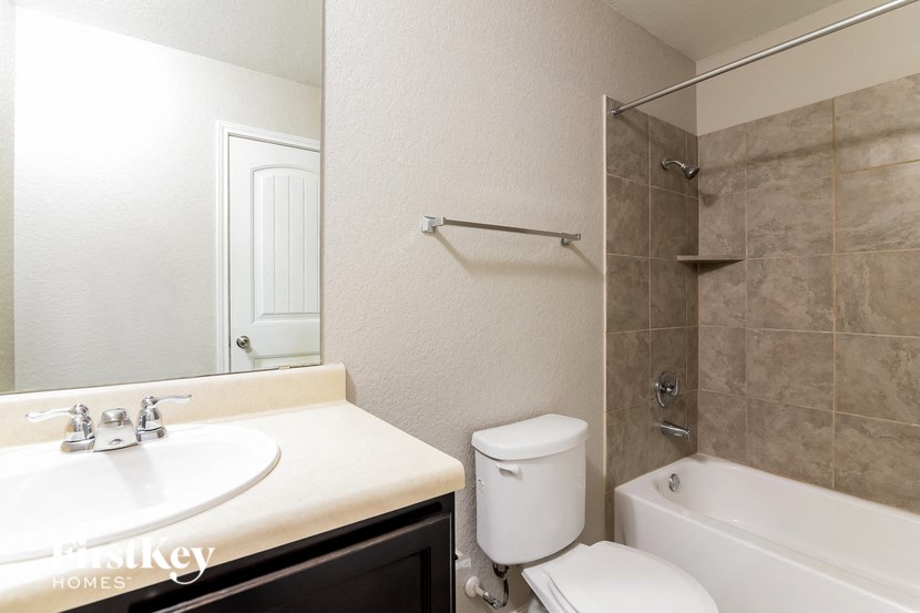 a bathroom with a sink toilet and tub and a shower